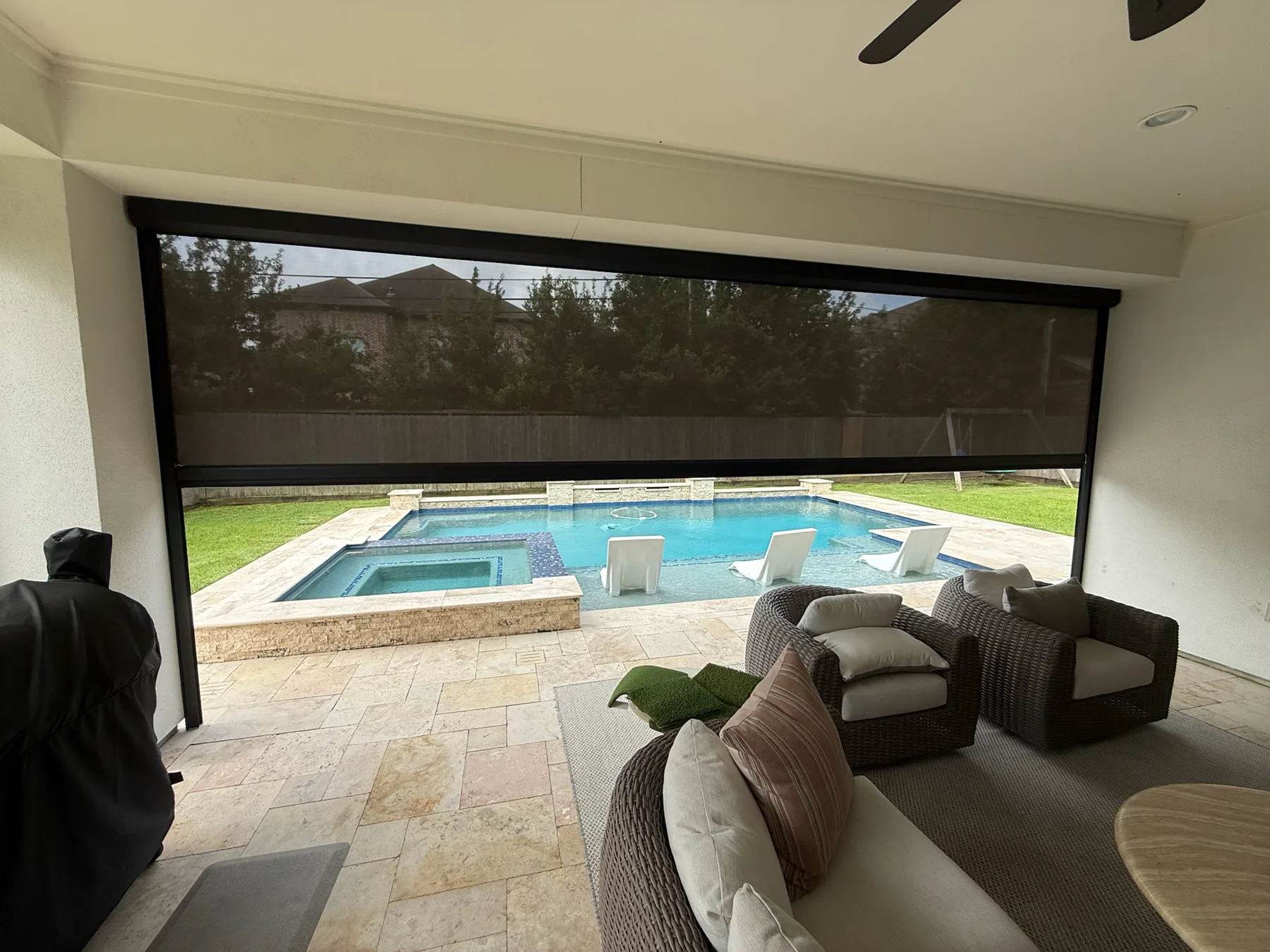 TMAX screened patio installation beside a swimming pool